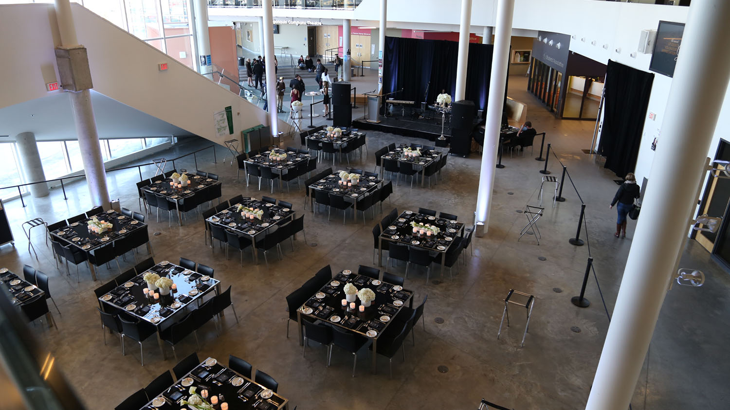 Gala layout, with stage, tables, and chairs.